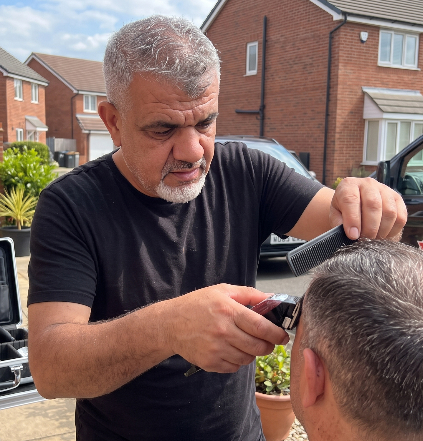 Feridun Dursun giving a mobile haircut